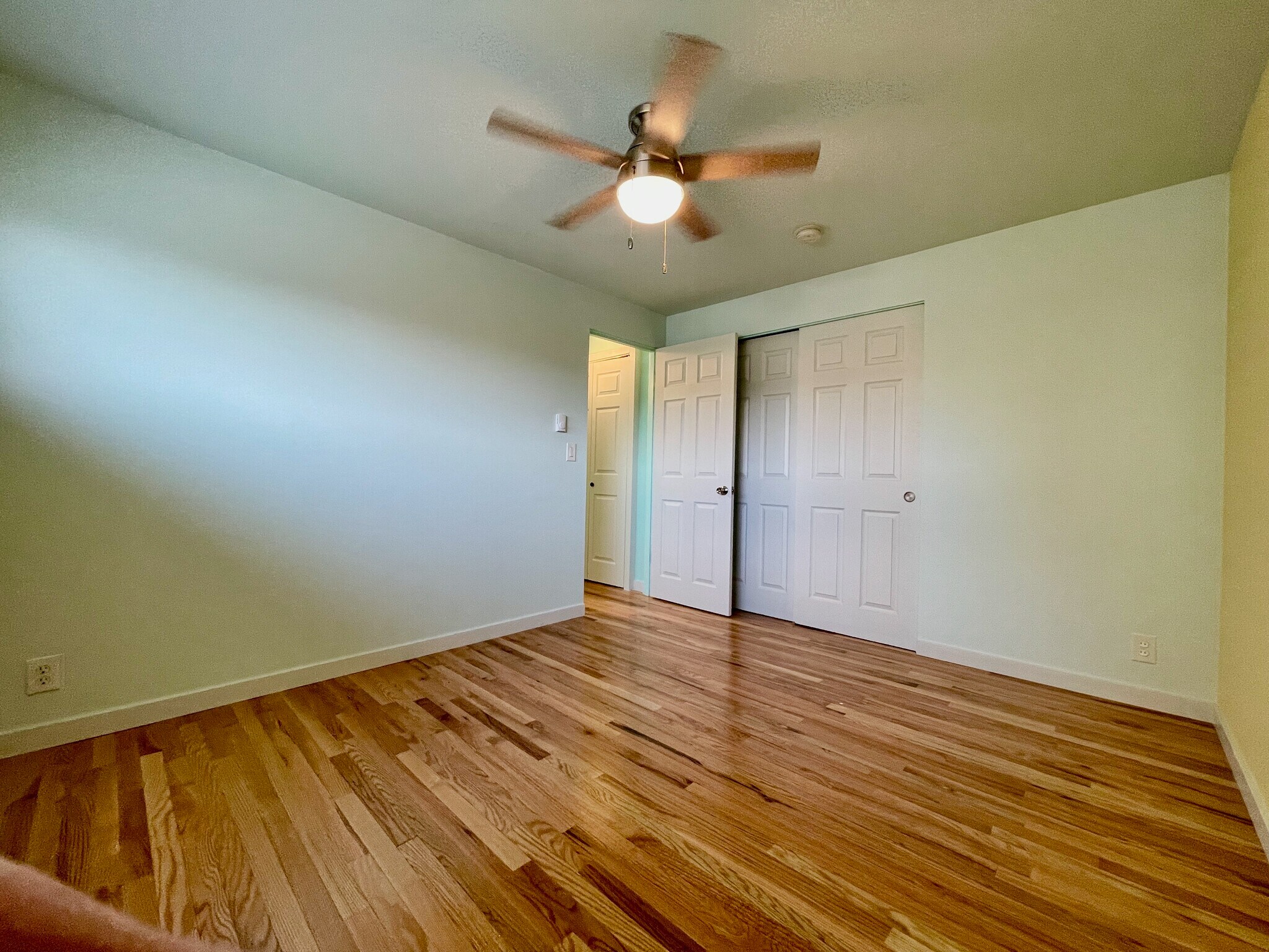 Spacious bedroom (picture is from similar apartment one floor up. Colors may vary) - 2801 14th Ave W