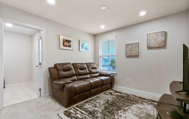 Building Photo - Water Front Home- 4 Large Bedrooms-3 baths Gated Community Call Sheila Campbell 407-687-7900