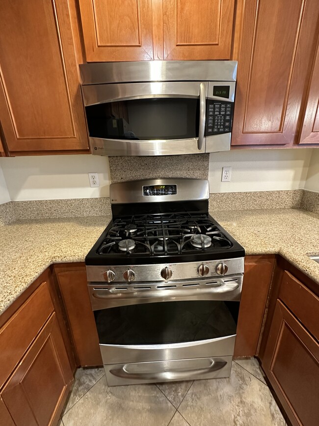 2nd floor kitchen stove and microwave (up close) - 22919 Mariposa Ave