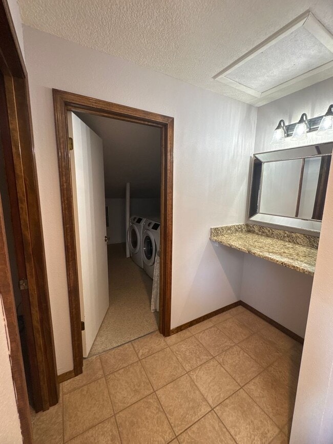 Building Photo - Two-story, four-bedroom, three-bathroom ho...