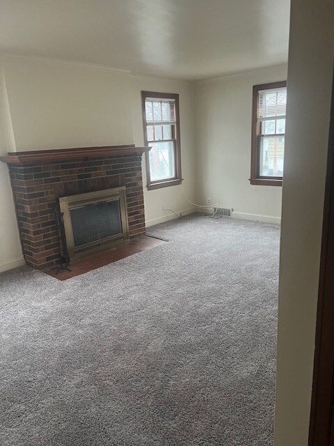 Spacious living room with working fireplace. - 147 Rossiter Rd
