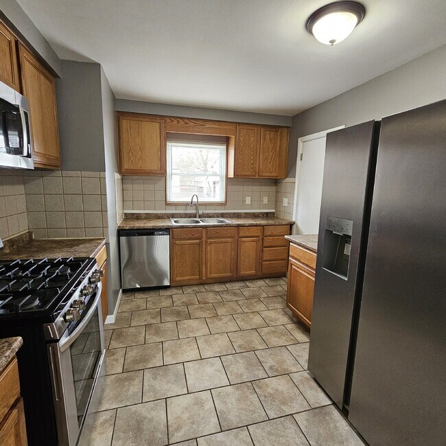 Building Photo - 3 Bedroom Updated Brick Ranch w/ 2 Car Attached Garage, Basement, Kitchen w/ All Stainless-Steel ...