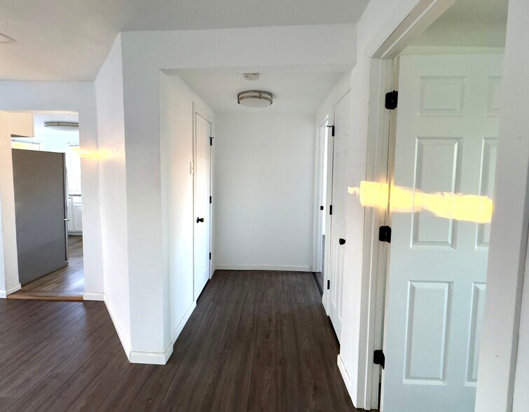 Hallway connecting the bedrooms to great room and bathroom - 16060 39th Ave