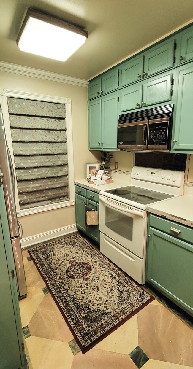 Window Looks Out To Back Patio Area and fills the kitchen with lots of Louisiana sunlight - 416 Doucet Rd