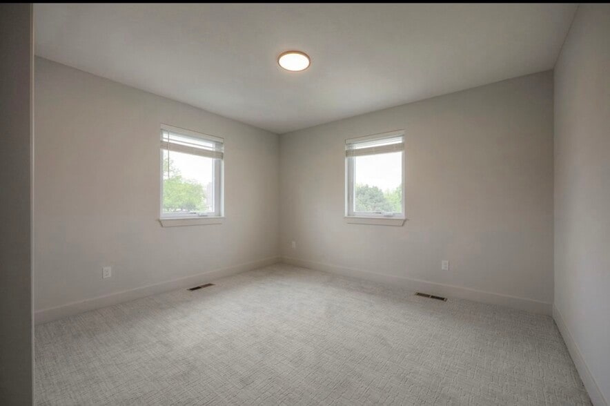 Spacious second bedroom with ample natural light and versatile layout and walk-in closet - 22907 W 72nd Ter
