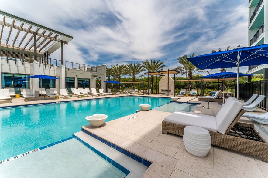 Sit poolside in style on our cabanas and lounge seating with fans to keep you cool! - The Reef Apartments