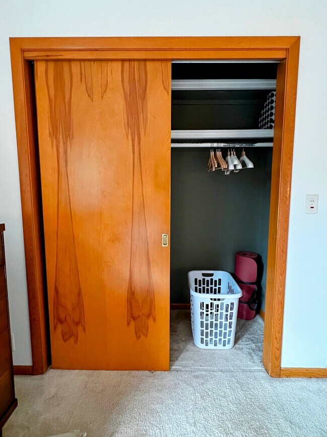 Wood hangers, laundry basket, and yoga mat. - 228 W Lexington Blvd