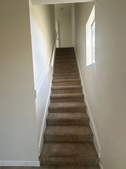 Stairs to second bedroom - 624 W 49th St