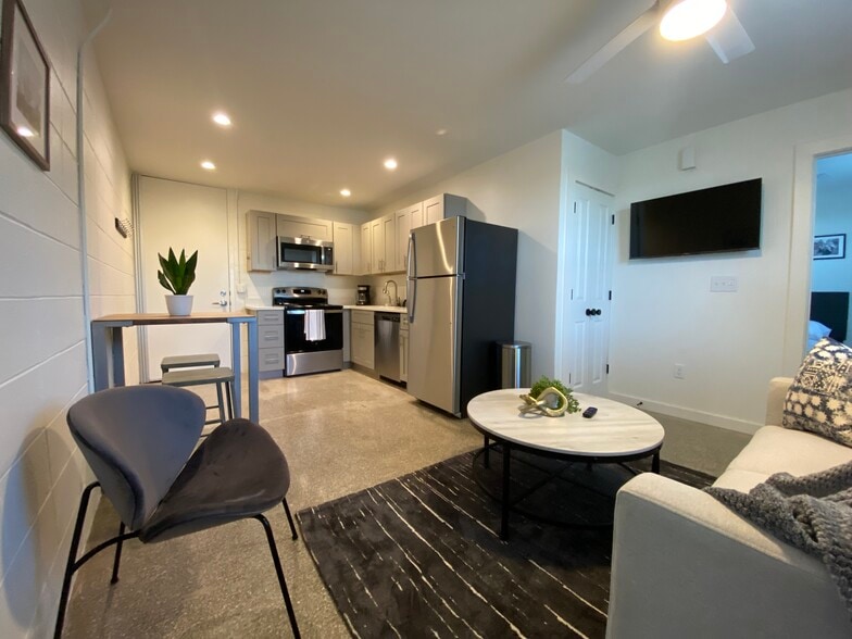 Unit Living Room/Kitchen - Studio Arms Apartments
