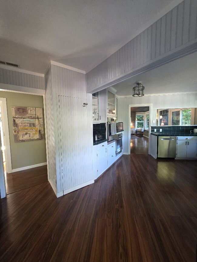 Building Photo - Breathtaking Home offers flexible living with bonus rooms ideal for an office, art studio, gym, o...