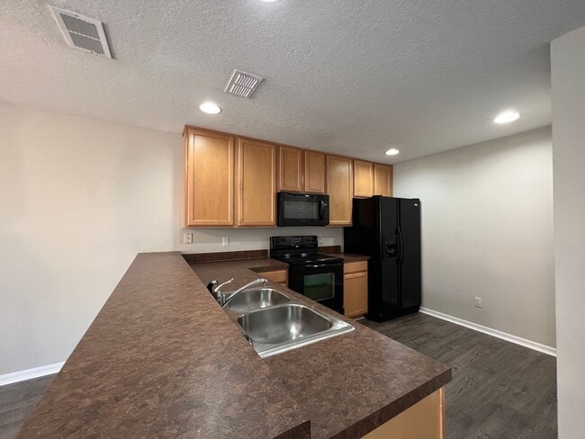 Building Photo - Bright 2BR 2.5BA Home w/ Community Pool/Playground Access • Full-Size Appliances • 1-Car Garage i...