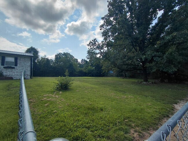 Building Photo - Fenced home close to post!