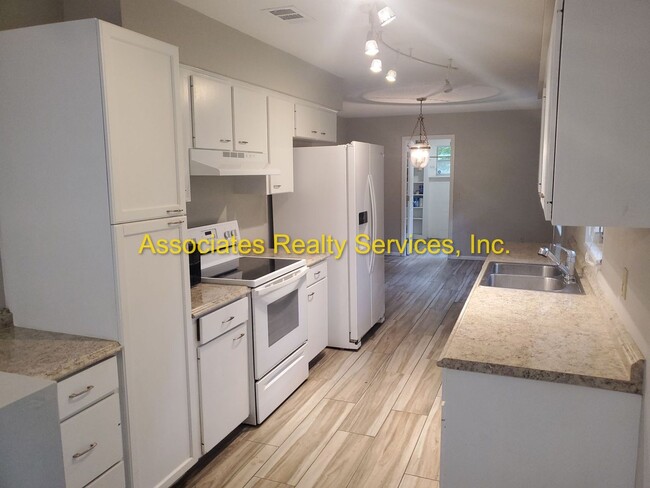 Building Photo - Three bedroom, two bath - 1720 Sq. ft., Acre lot