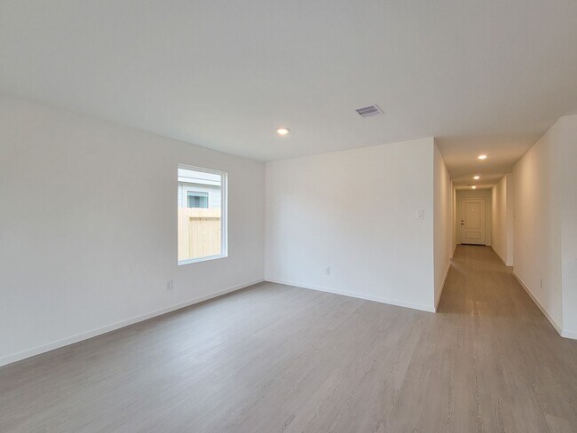 Building Photo - This great new single-story design makes smart use of the space available. At the front are all t...