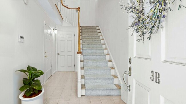 Foyer with closet and Garage/mechanicals access. - 3B Ludlow Rd