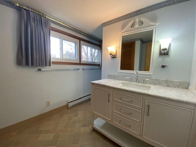 Building Photo - Welcome to this charming three-bedroom, tw...