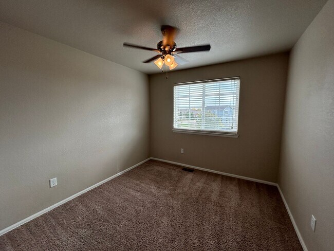 Building Photo - $500 Off First Month Of Rent! Modern 3BR Townhome with Fenced Yard & Garage