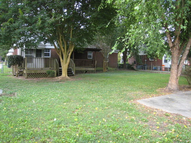 Large fenced backyard. - 1911 E 4th St