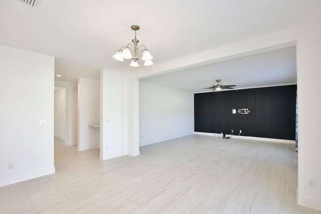 Building Photo - Stylish and Spacious 3/2.5 Home with No Re...