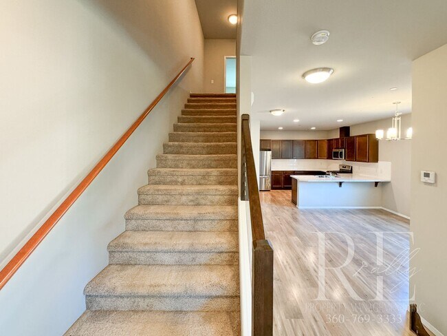 Building Photo - Modern End-Unit Townhome with Private Fenced Yard, Gourmet Kitchen & Spacious Layout