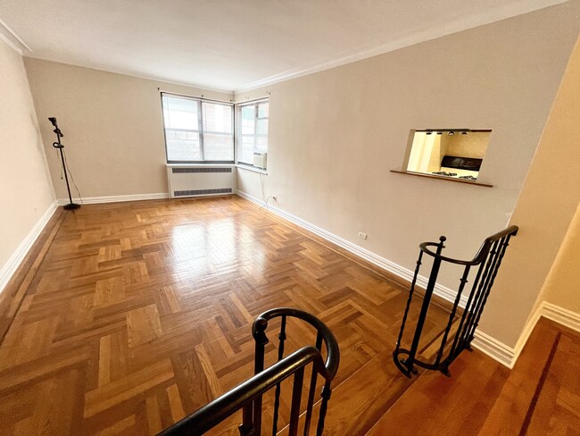 Spacious drop down studio living area; beautiful parquet floors - 210 Martine Ave