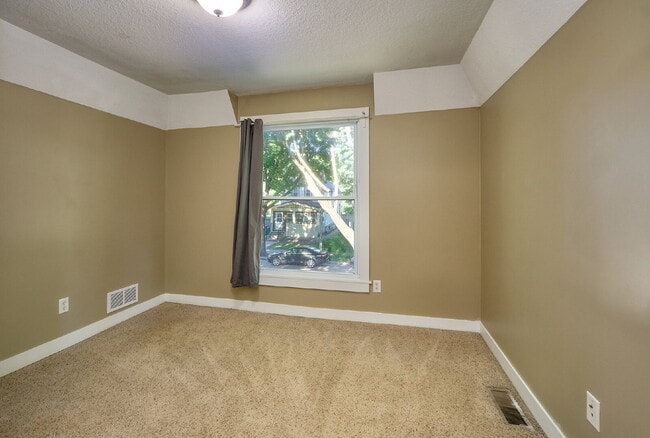 Building Photo - Charming 4-Bedroom Home with Gleaming Hardwood Floors in Vibrant Minneapolis Neighborhood!