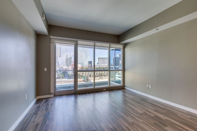 Building Photo - Iconic Strip-View Luxury | Elegant 1BR + Den High-Rise Residence