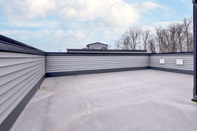 Building Photo - Three Story Brick End Unit with Rooftop Terrace