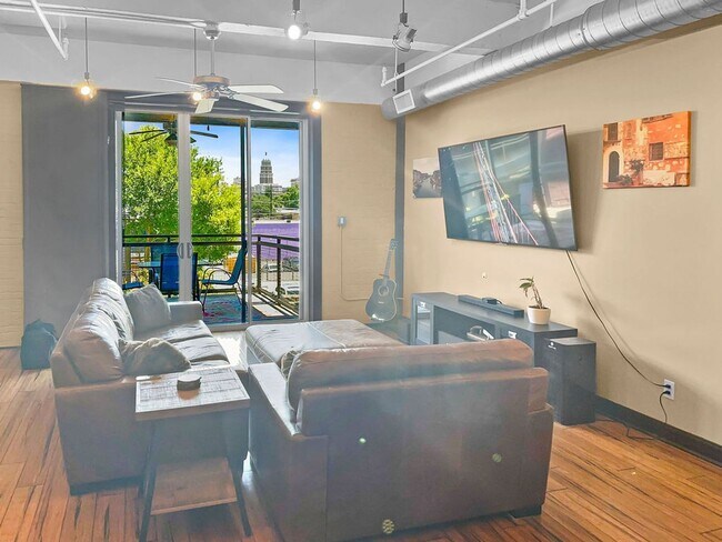 Building Photo - Modern Downtown Condo with Stunning City V...