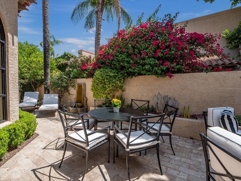 The back courtyard, which also features a sofa and coffee table by the 2 chairs (sofa not shown) - 8437 N 84th St