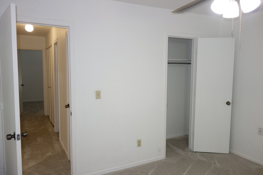 Secondary Bedroom w/hallway view on left and closet on right - 6604 S Utica Pl