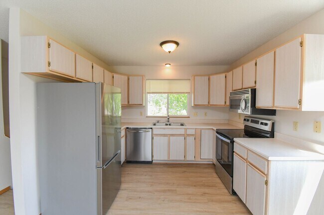 Building Photo - Updated 3BR Split-Level Home with Huge Deck, Fenced Yard & 2-Car Garage Near I-29!