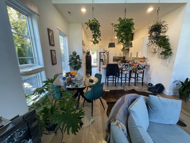 View from living room toward dining table and kitchen. - 2312 Island Home Ave