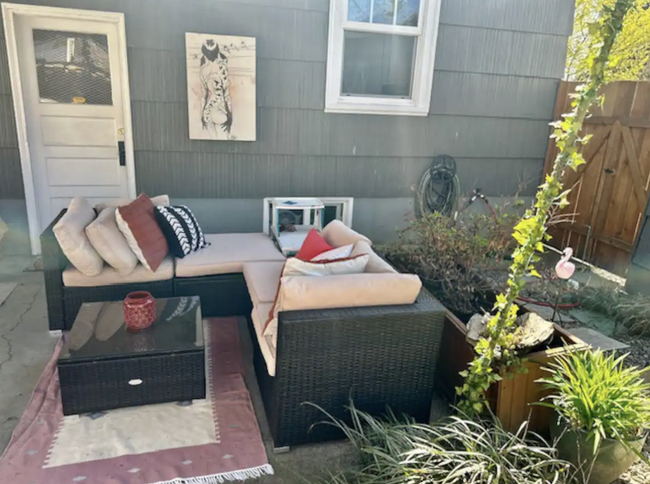 Outdoor seating area for lounging or dining in backyard. - 4115 SE Gladstone St