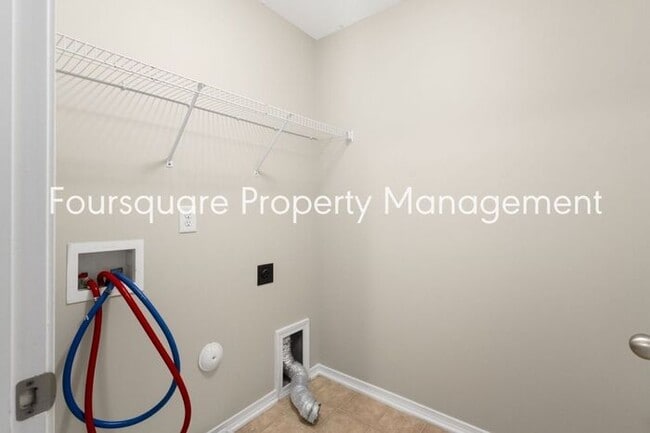 Building Photo - Charming Townhome with Open Layout, Back Patio & One-Car Garage – Near RTP, RDU & Everyday Conven...