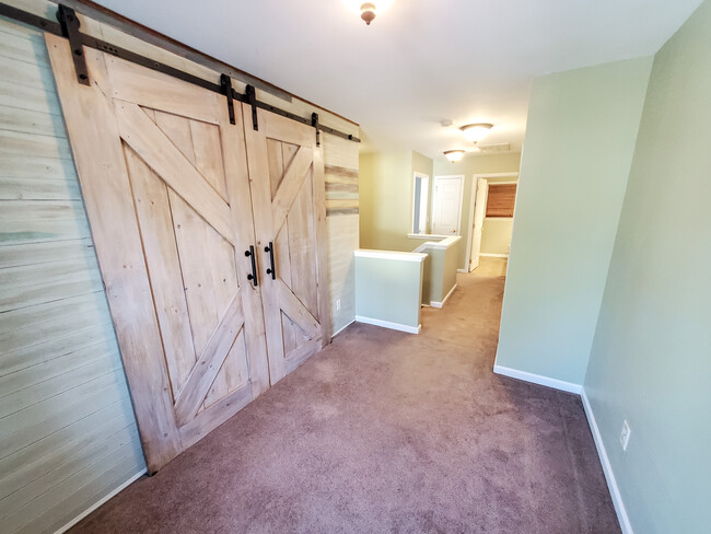 Custom Barn Doors entry to 2nd bedroom - 403 Arbor Oaks Dr