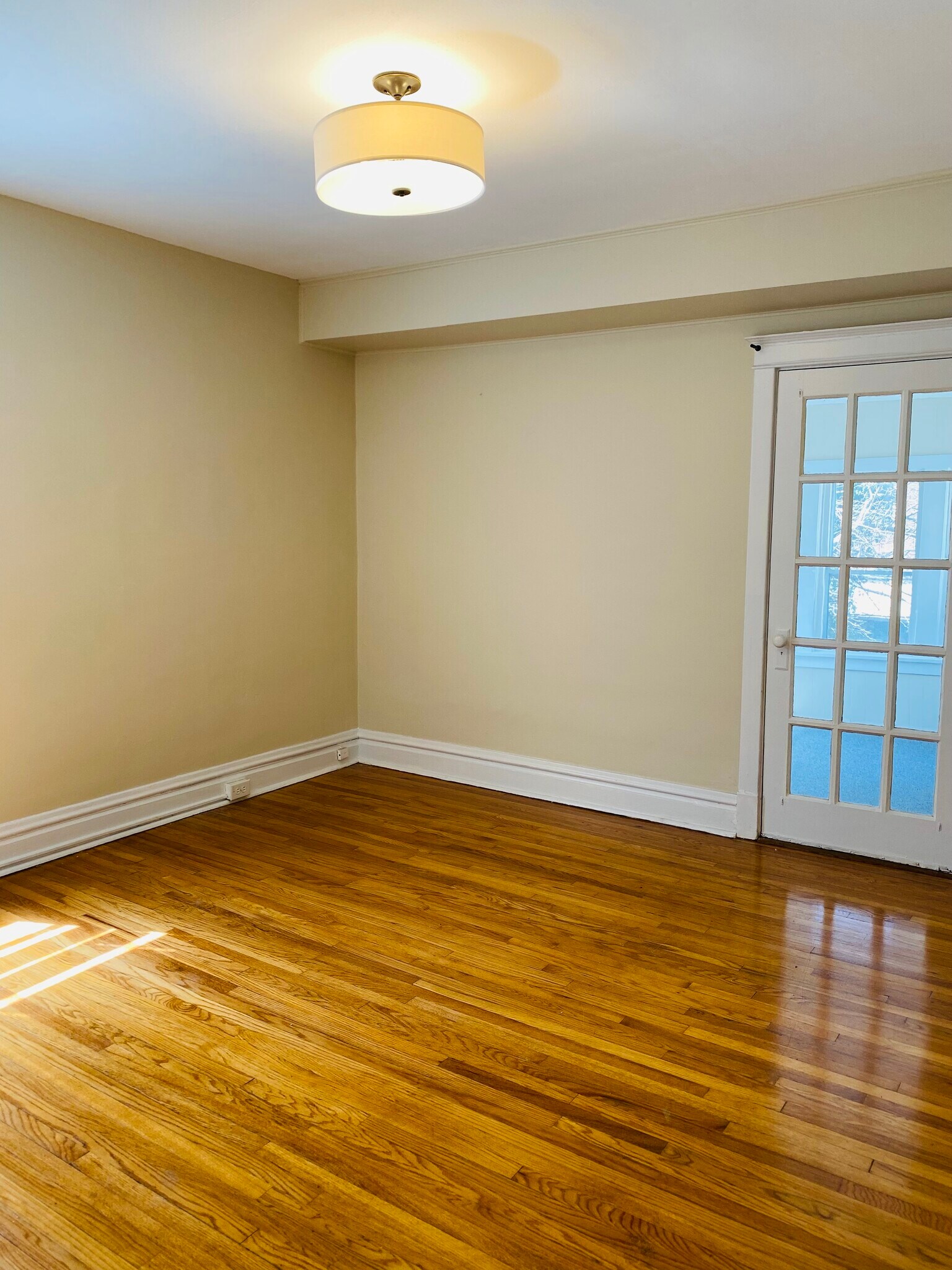Spacious bedroom with door leading to the Sunroom - 2127 Alfred Ave