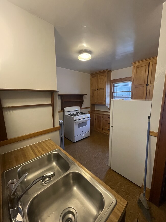 View from the kitchen entrance from dining room. New stove and refrigerator and tons of cabinets. - 4235 Pleasant Ave