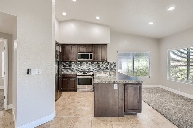 Building Photo - Discover this spacious and well-appointed 2-bedroom + office/den, 2-bath condo located in the hig...