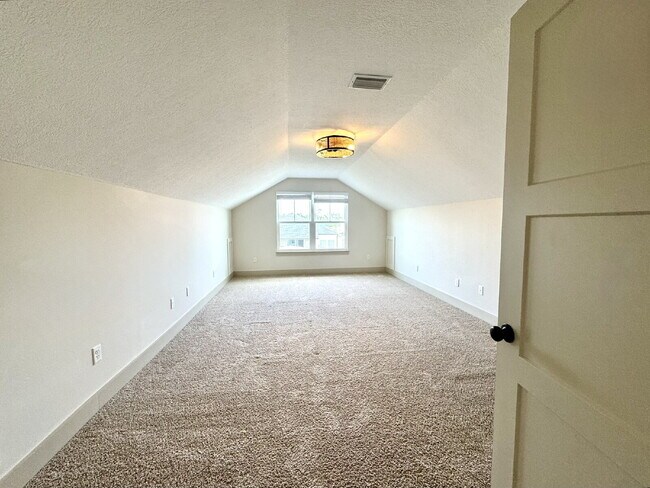 Building Photo - Need Space?  How about 5 bedrooms, 2.5 baths + an extra bonus area upstairs so that the kids can ...