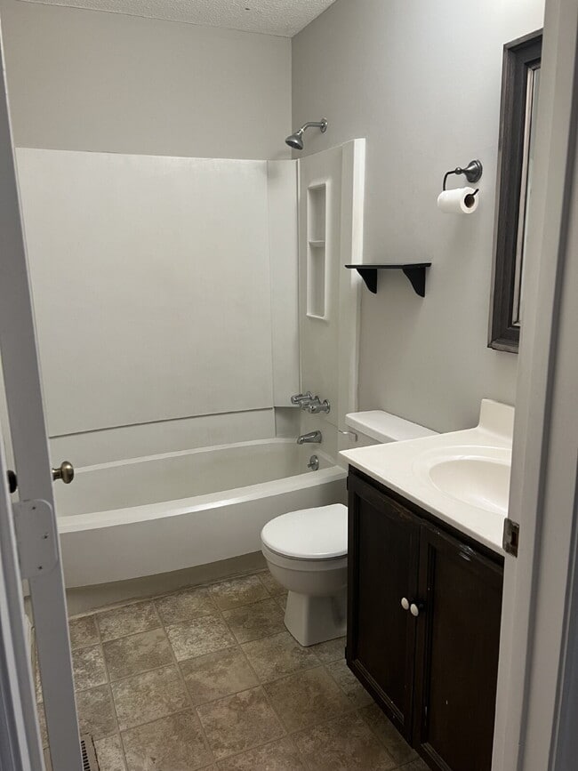 Building Photo - Charming 3 bedroom 2 bath townhome with lots of light and open downstairs. Galley kitchen, lots o...