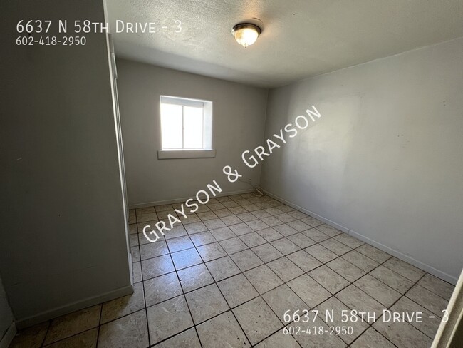 Building Photo - 6637 N 58th Dr