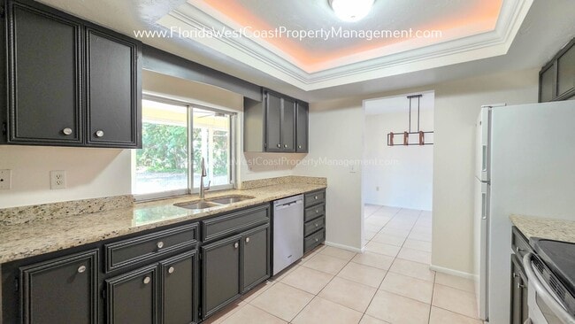 Building Photo - SPACIOUS SARASOTA HOME WITH LARGE FENCED YARD! MOVE IN READY! ALL TILE/ NEW LVP!