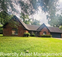 Building Photo - charming three-bedroom, two-full-bath resi...