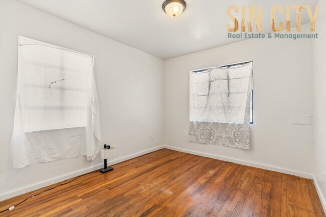 Building Photo - "Charming 1-Bed Duplex with Hardwood Elegance in Downtown Las Vegas!"