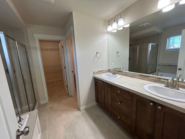 Building Photo - 4 bed/2.5 bath and 3 car garage and a down...