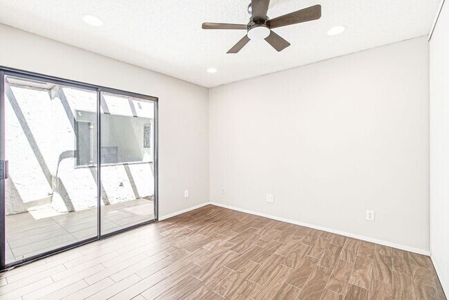 Building Photo - Gated 3-Bedroom Townhome with Fireplace, Patio & 2-Car Garage