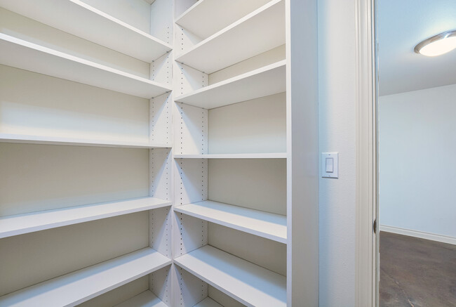 Walk-in bedroom closet w/custom adjustable built-ins. - 6315 NE 36th Ave