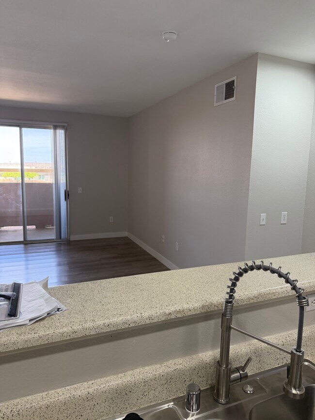 view of living room and sliding glass doors over patio - 231 W Horizon Ridge Pky