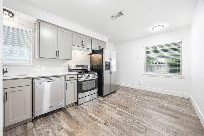Building Photo - **$40K+ IN UPGRADES AND A FENCED BACKYARD WITH TWO STORAGE BUILDINGS**